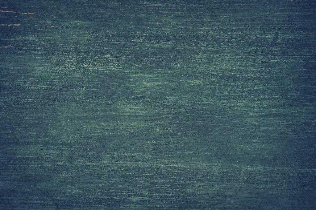 Dark textured wall in green.