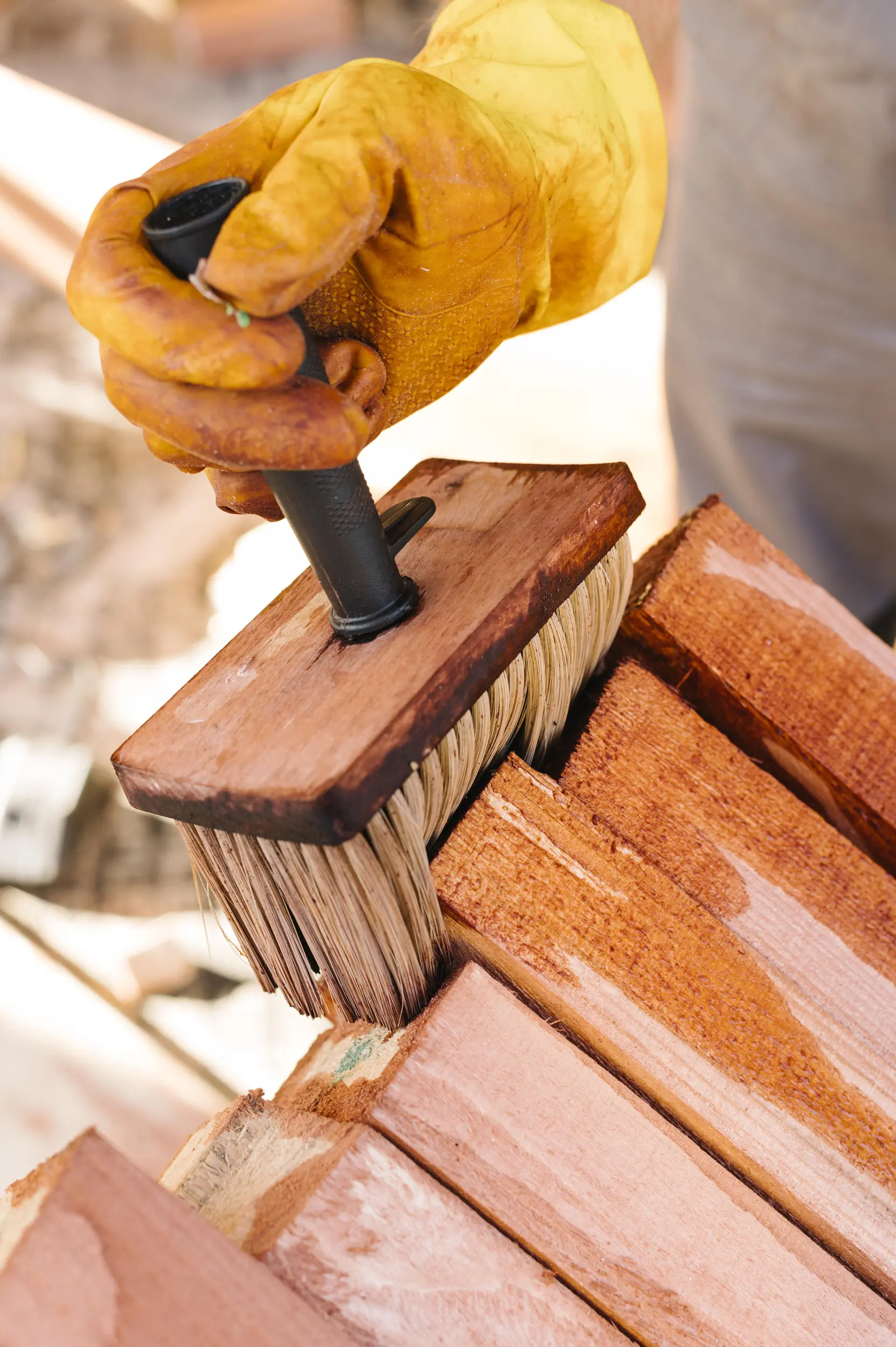person-varnishing-wood Deck Refinishing