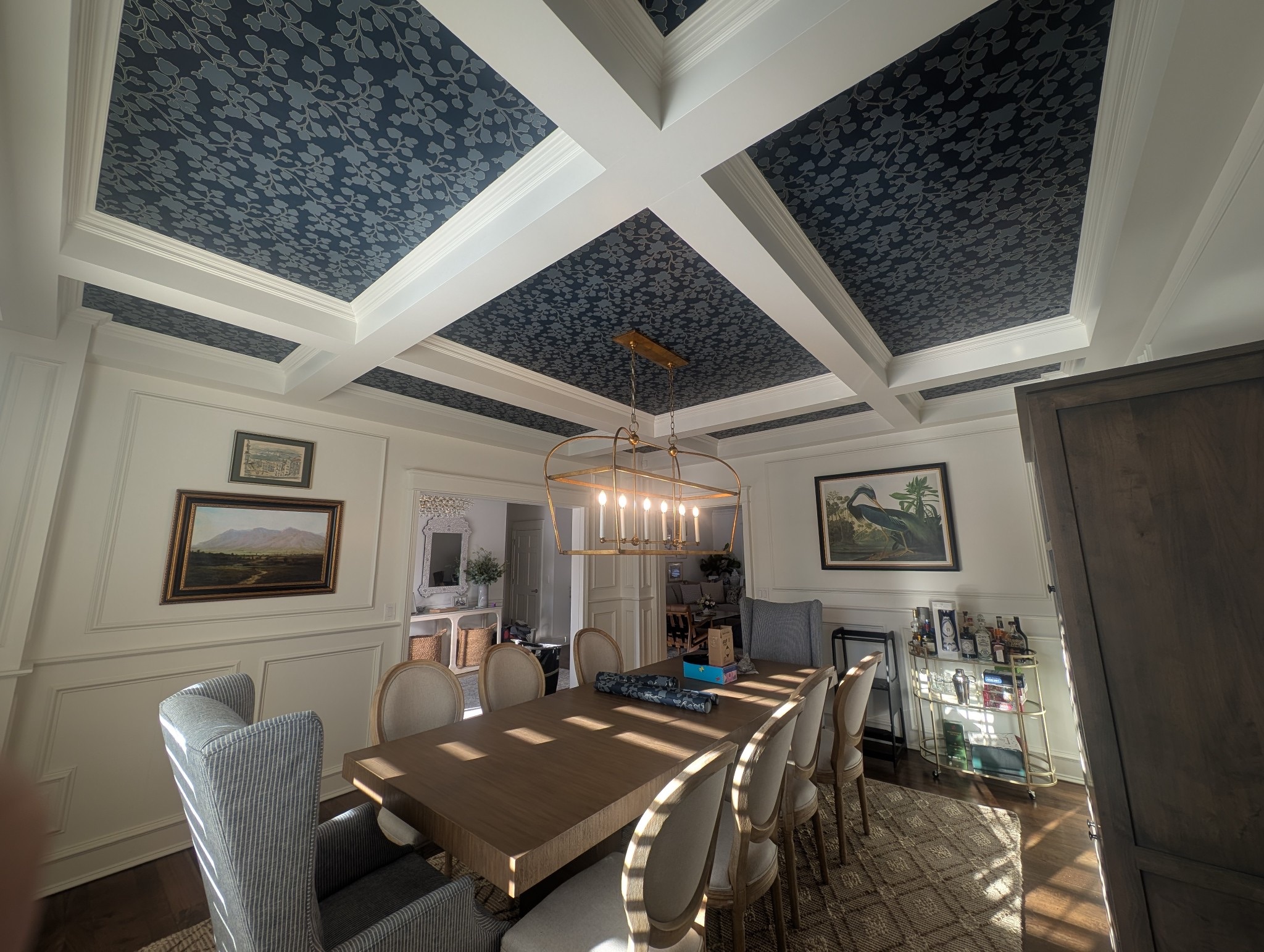 615934948132185771 White painted walls with high archways in a large open space with exquisite curved windows and hardwood floors.