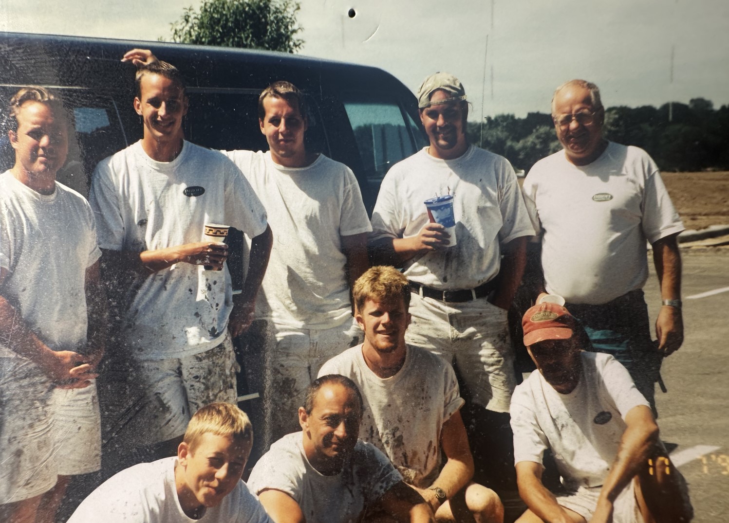Early Imhoff Painting Company crew gathered beside a work van in Minnesota